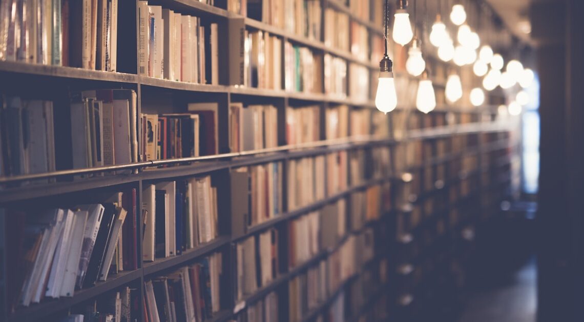 Stack of open books representing celebrity book lovers and famous readers