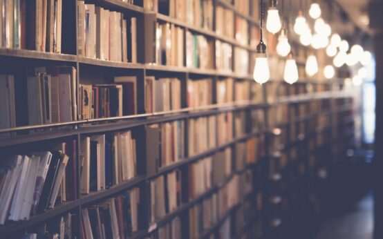 Stack of open books representing celebrity book lovers and famous readers