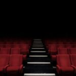 A grand cinema theater representing the world's wealthiest Hollywood actors