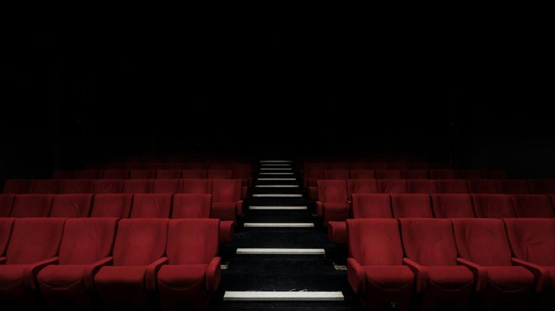 Empty cinema with red seats — the ultimate true crime documentary guide