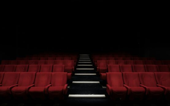 Empty cinema with red seats — the ultimate true crime documentary guide